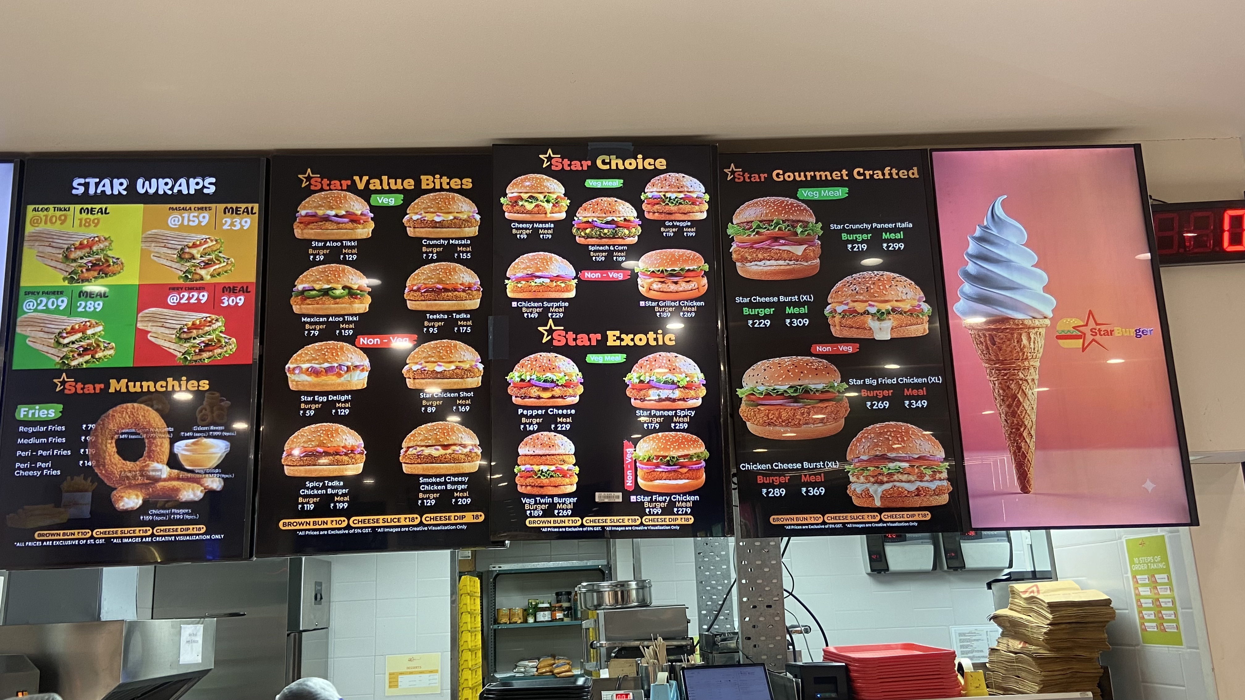 The counter and menu boards at Star Burger, Amanaka, Raipur